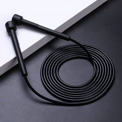 corde à sauter noire roule sur une surface