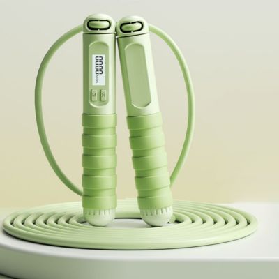 corde a sauter verte avec compteur